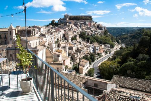 a view of a town on a hill at Intervallo Boutique Hotel in Ragusa