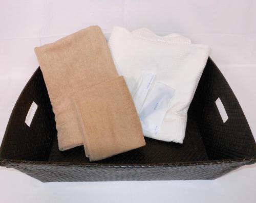 a basket filled with towels and other towels at Hotel New Tohoku in Tokyo