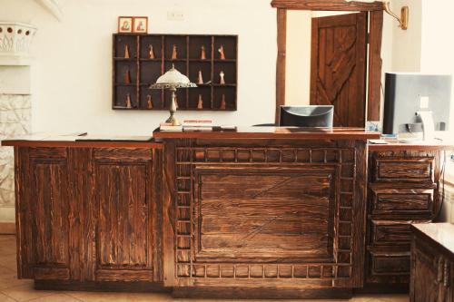 a wooden counter with a lamp on top of it at Golden Embankment in Pskov