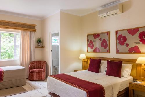 Кровать или кровати в номере Centre Court B&B
