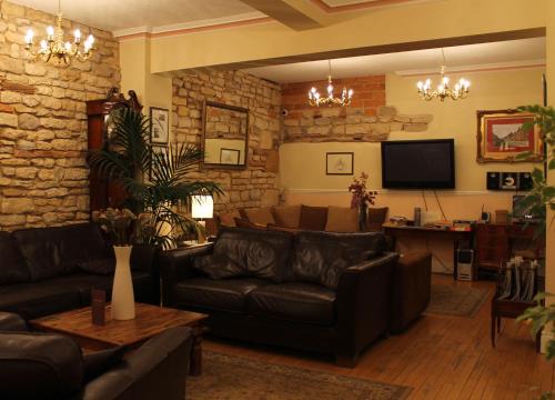 a living room filled with furniture and a fire place at Bail House in Lincoln