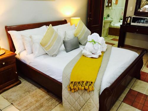 Letto o letti in una camera di Waterkloof Guest House