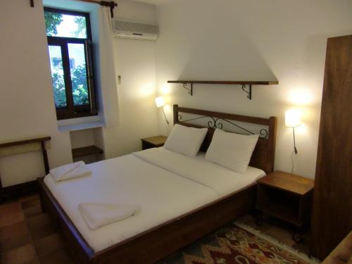 מיטה או מיטות בחדר ב-Hotel Happy Caretta