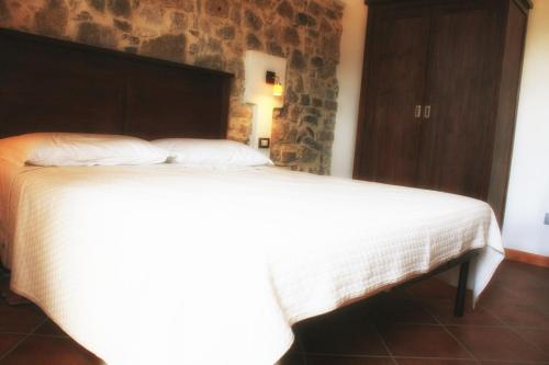 Postel nebo postele na pokoji v ubytování Agriturismo Case Tabarani
