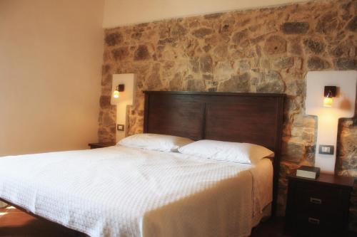 Postel nebo postele na pokoji v ubytování Agriturismo Case Tabarani