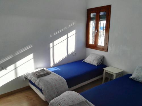 Ένα ή περισσότερα κρεβάτια σε δωμάτιο στο Ca Xotxim