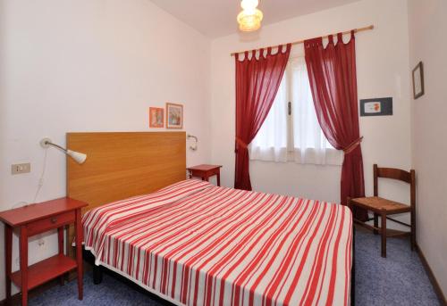 Een bed of bedden in een kamer bij Villaggio Michelangelo