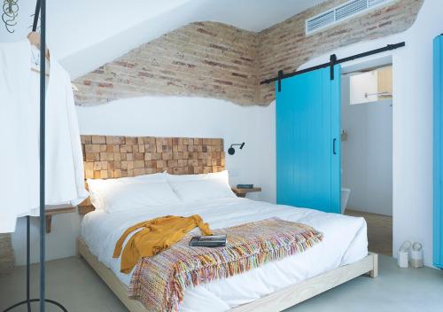 Tempat tidur dalam kamar di Apartamentos La más Bonita