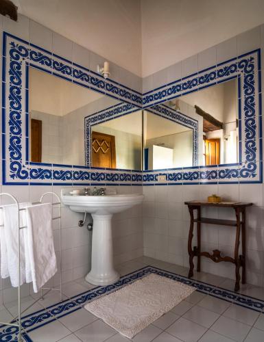 a bathroom with a sink and a mirror at Holiday Home Arpicella in Pienza