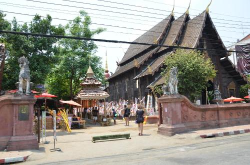 a group of people standing in front of a building at Lamphu House Chiang Mai in Chiang Mai