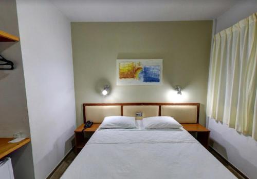 Katil atau katil-katil dalam bilik di Ecos Hotel Tourist