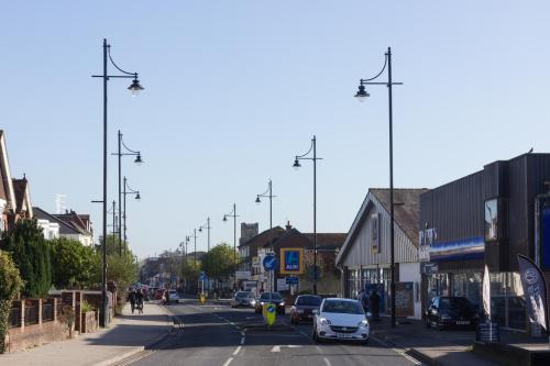 a city street with cars parked on the street at Prince Apartments in Fareham