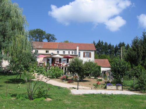 a large house with a garden in front of it at Hotel La Croix des Bois in Lalizolle