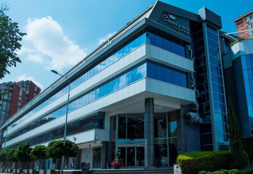 an external view of a building at Queen's Hotel - Zebra Centre in Skopje