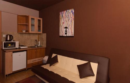 a living room with a couch in a room at AnVa House in Budapest