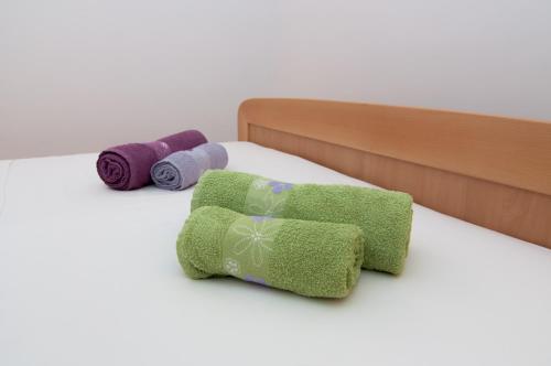 Postel nebo postele na pokoji v ubytování Apartmani Galija