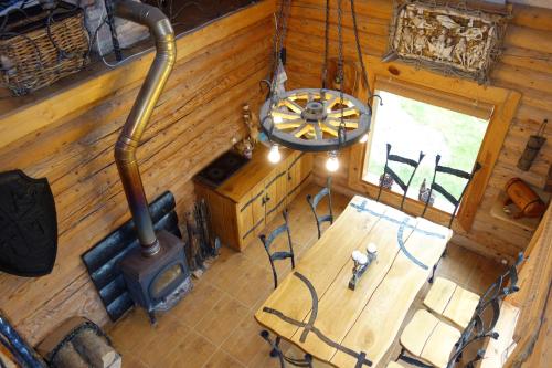 an overhead view of a dining room with a wood stove at Sveciu namelis in Šiauliai