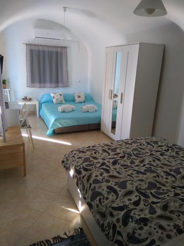 Ένα ή περισσότερα κρεβάτια σε δωμάτιο στο Casa Bianco e Blu