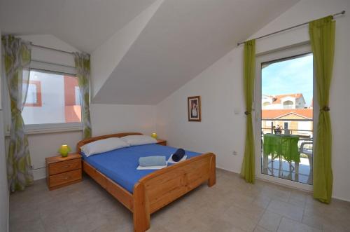 Postel nebo postele na pokoji v ubytování Apartments Mara