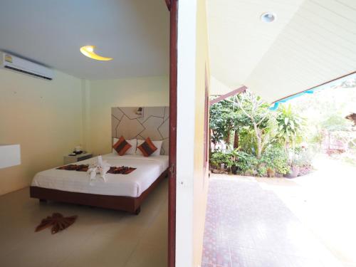 A bed or beds in a room at Lanta Fevrier Resort