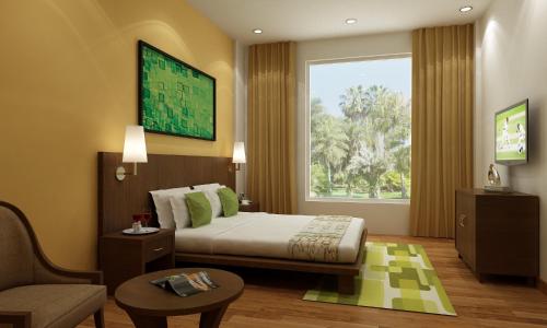 מיטה או מיטות בחדר ב-Lemon Tree Hotel Alwar
