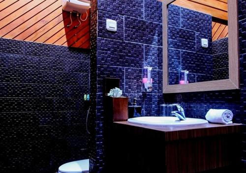Kylpyhuone majoituspaikassa Green Tropical Village