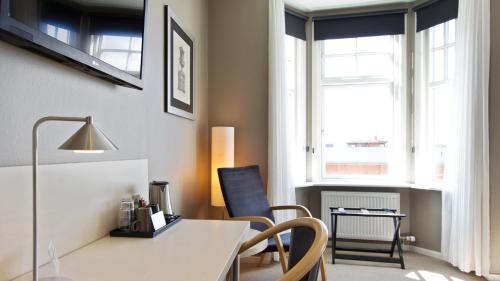 Ein Sitzbereich in der Unterkunft Hotel Kronjylland