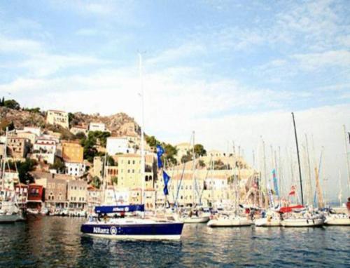 a bunch of boats are docked in a harbor at Andrea Pension in Hydra