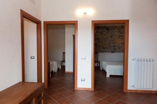 Postel nebo postele na pokoji v ubytování Agriturismo Case Tabarani