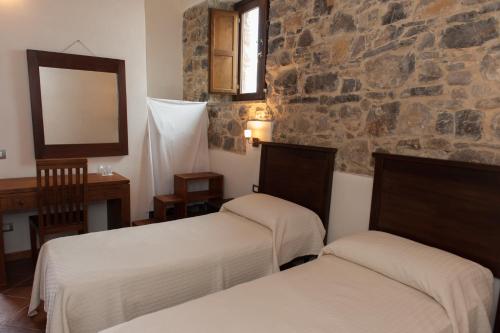 Postel nebo postele na pokoji v ubytování Agriturismo Case Tabarani