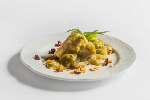 a plate of food on a white plate at Finca El Cotillo in Linares