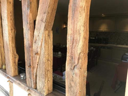 a view of a kitchen through a wooden window at Le Clos Margot in Vertus
