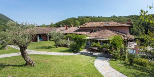 a house with a garden in front of it at Guest House Valentincic in Nova Gorica