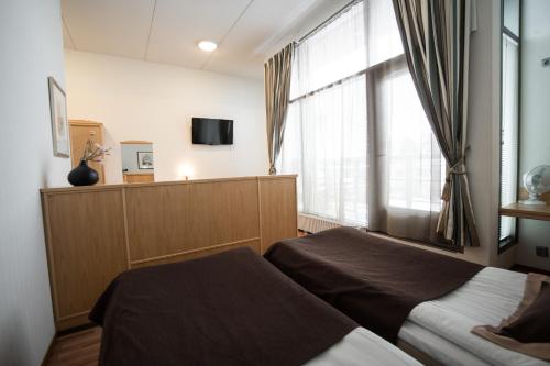 Телевизор и/или развлекательный центр в Hotel Vallonia
