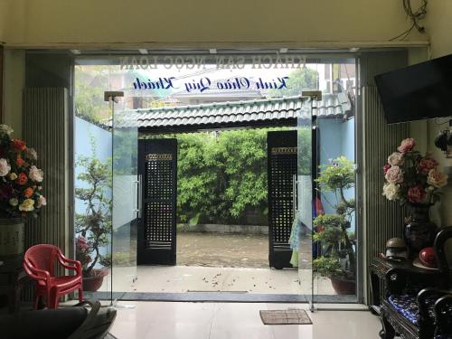 an open door with a sign that readsoutside a house at Ngoc Loan Hotel in Ho Chi Minh City