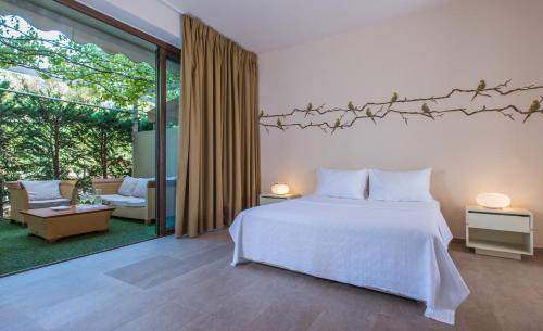A bed or beds in a room at Club Agia Anna