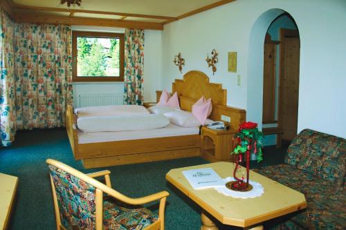 Postel nebo postele na pokoji v ubytování Hotel Hochland