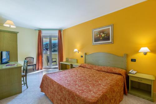 Postel nebo postele na pokoji v ubytování Hotel Rosa dei Venti