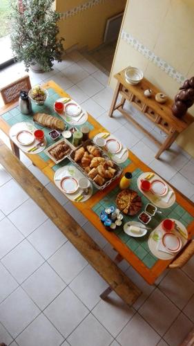 a table with a bunch of food on it at La Grange in Nohant-Vic