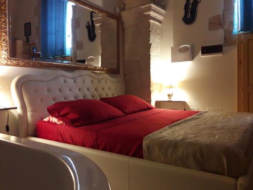 Postel nebo postele na pokoji v ubytování L'antico palazzo