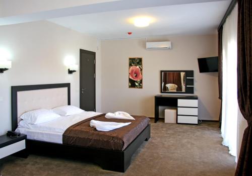 Кровать или кровати в номере Hotel King