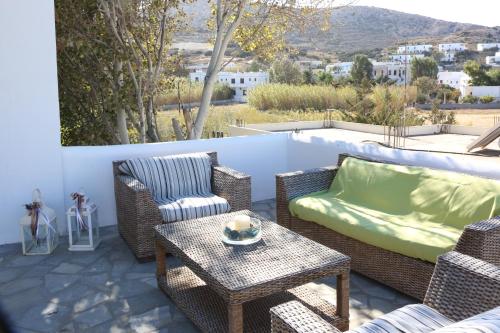 a patio with a couch and chairs and a table at Blue Sky in Galissas