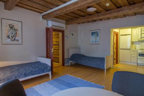 מיטה או מיטות בחדר ב-Tampere Maja