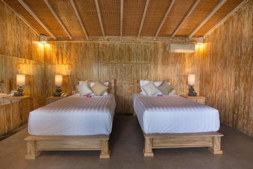 Een bed of bedden in een kamer bij Bella Kita Mountain Retreat & Spa