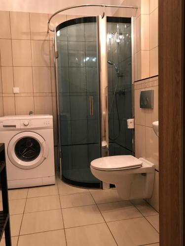 Ванная комната в Nowa Apartamenty Apartament Słoneczny Bulwar
