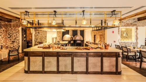 a kitchen with a large island in a room at Banyan Tree Puebla in Puebla