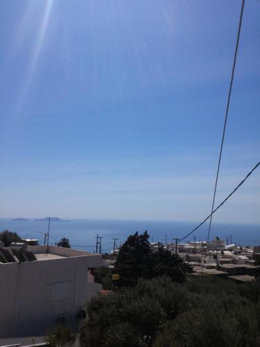 a view of the ocean from a house at Archontika Apartments in Kerames