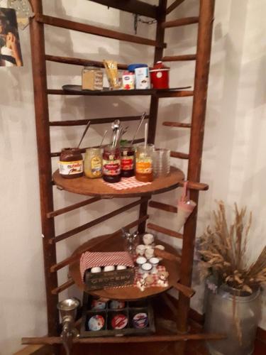 a wooden shelf with food items on it at Hotel Trendtino in Eisenberg