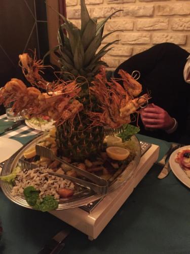 a plate of food on a table with a pineapple at my CITY HOTEL in Eisenberg