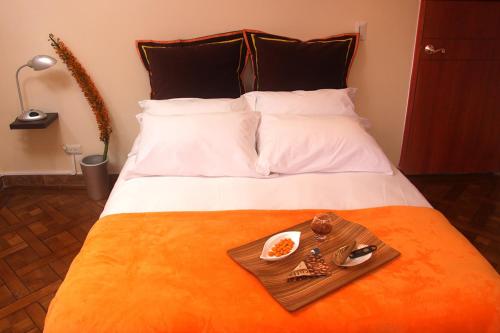 מיטה או מיטות בחדר ב-6 Suites Hotel